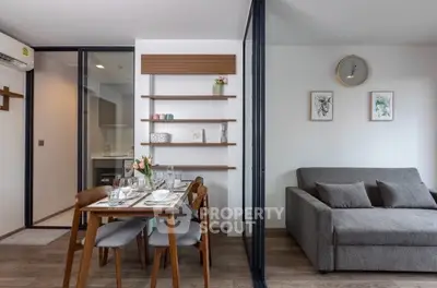 Modern living room with dining area and stylish decor in a contemporary apartment.