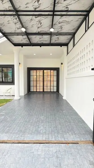 Elegant covered entrance with modern design and stylish lighting