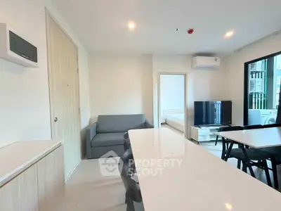 Modern living room with dining area and sleek furniture