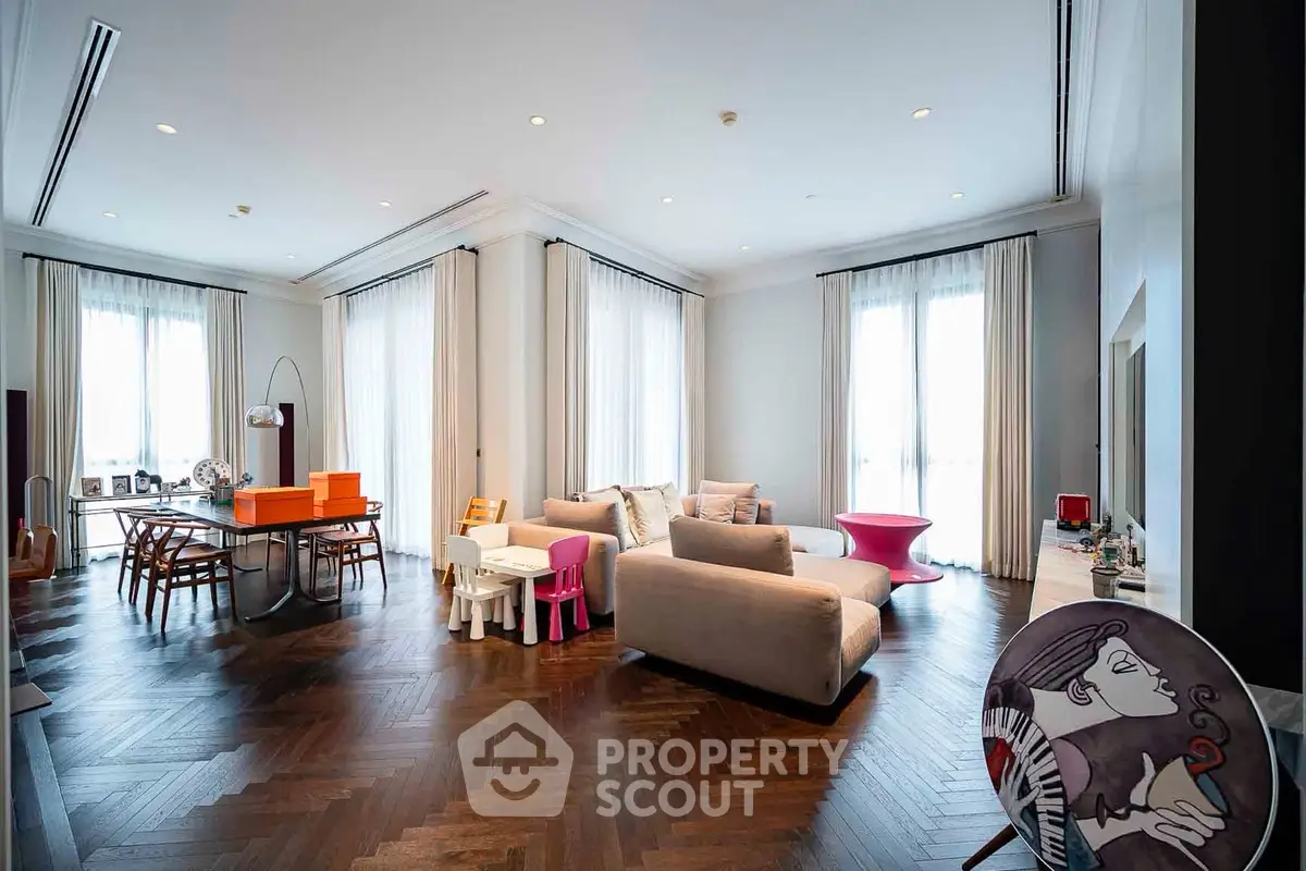 Spacious and stylish living room with elegant decor and hardwood floors