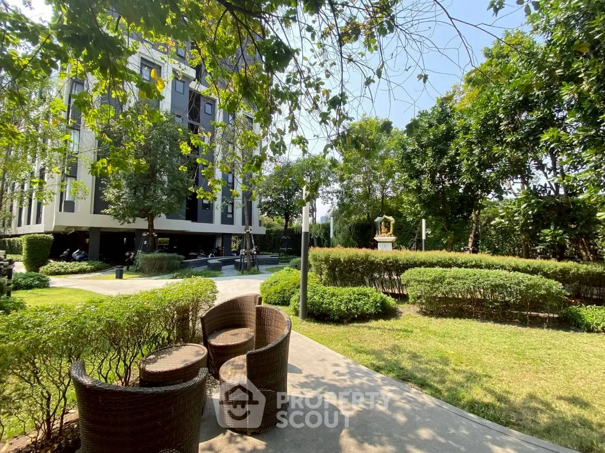 Luxurious garden view with modern building and outdoor seating area