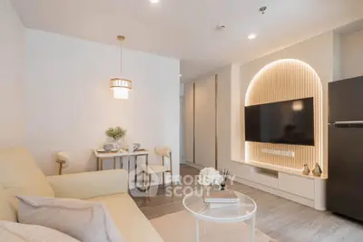 Modern living room with stylish decor and wall-mounted TV