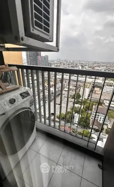 High-rise balcony with city view and washing machine, perfect for urban living.