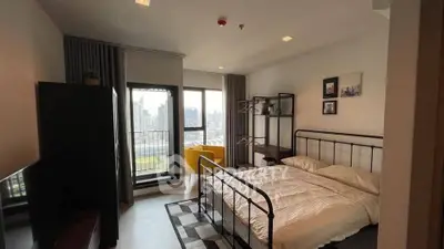 Modern bedroom with city view and stylish decor in urban apartment