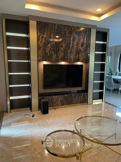 Luxurious living room with elegant marble TV wall and modern decor