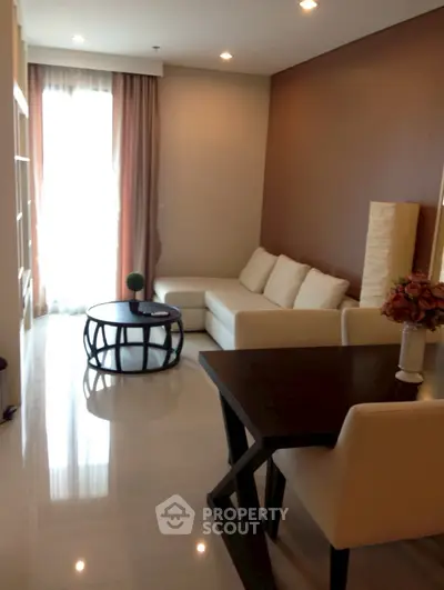 Modern living room with cozy sofa and stylish decor in a bright apartment.