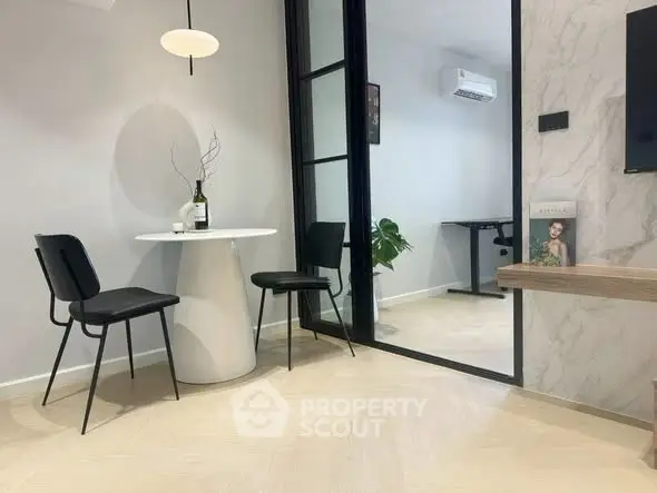 Modern interior with stylish dining area and home office setup