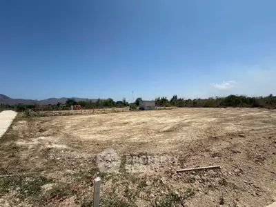 Expansive vacant land with clear skies, ideal for development opportunities.