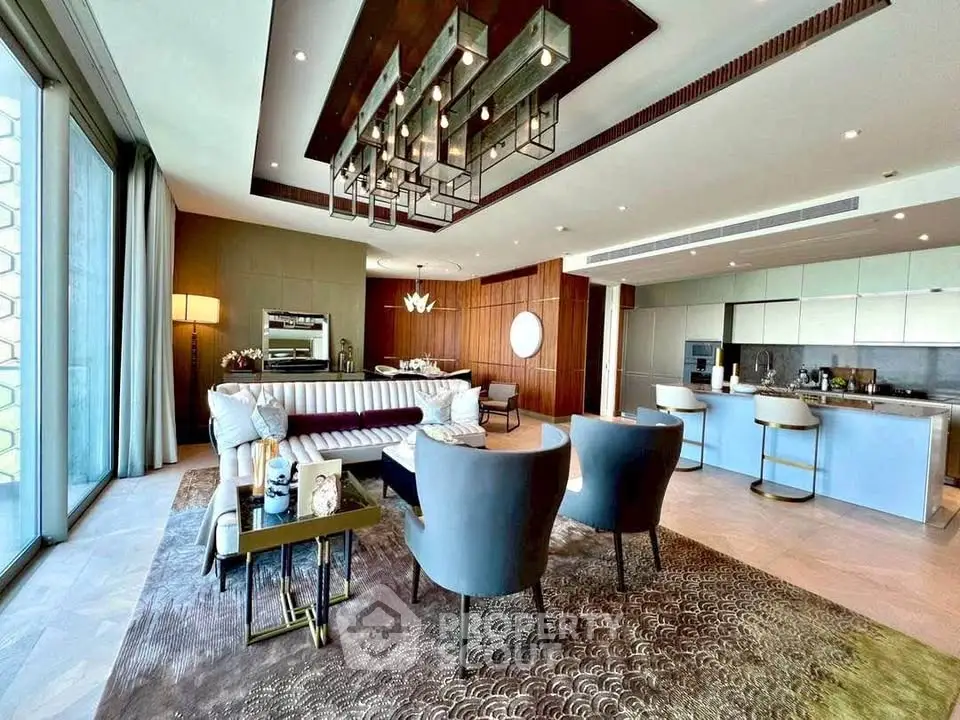 Luxurious open-plan living room with modern decor and elegant lighting in a high-end apartment.