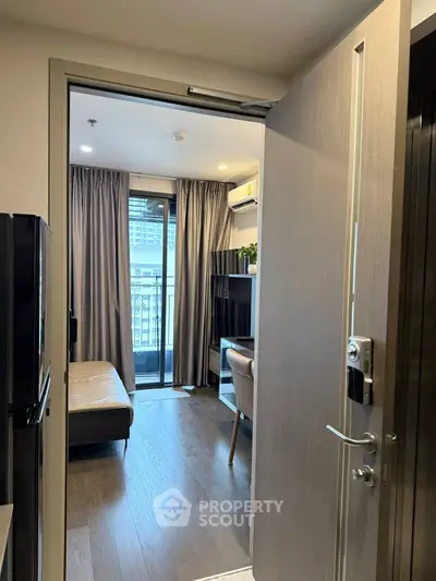 Modern apartment entrance with sleek interior and balcony view