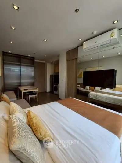 Modern bedroom with air conditioning and stylish decor in a cozy apartment.