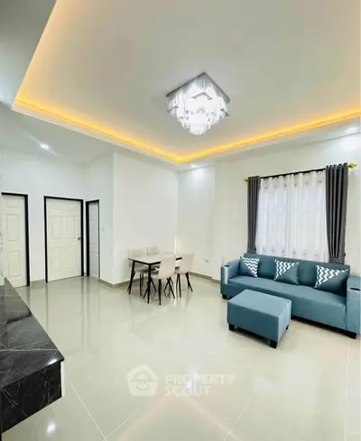 Spacious modern living room with elegant lighting and stylish furniture