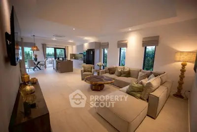 Spacious modern living room with open kitchen and stylish decor