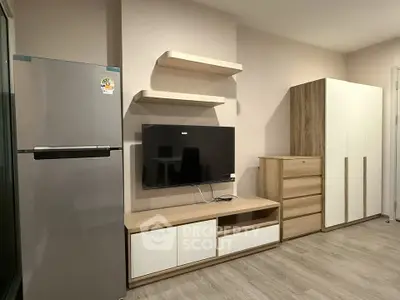 Modern living room with sleek furniture and a large fridge, perfect for contemporary living.