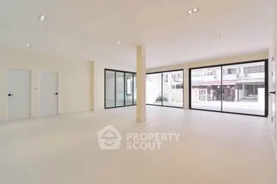 Spacious modern interior with large windows and minimalist design