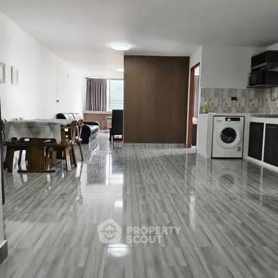 Spacious open-plan living area with modern kitchen and dining space