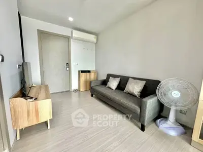Modern living room with sleek furniture and air conditioning in a stylish apartment.