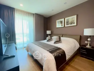 Luxurious bedroom with elegant decor and large window for natural light