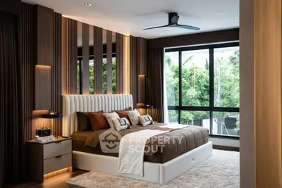 Luxurious modern bedroom with large windows and elegant decor