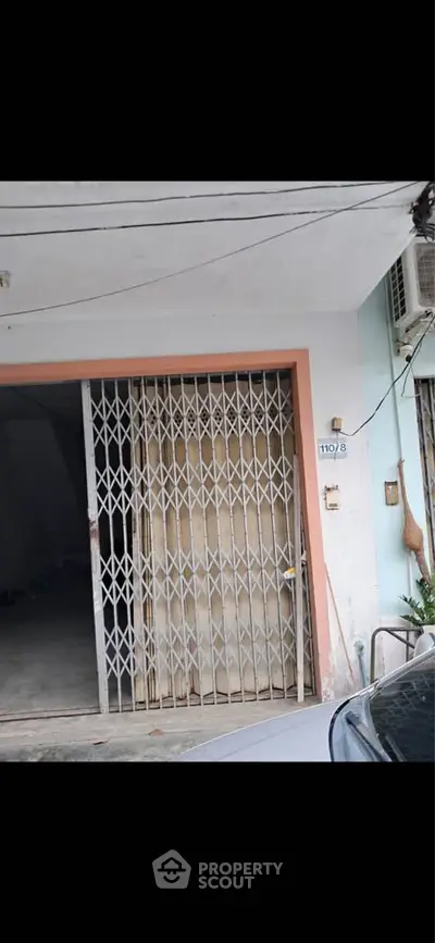 Secure garage entrance with metal gate in urban residential area