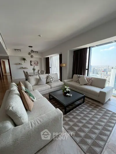 Spacious modern living room with panoramic city views and elegant decor