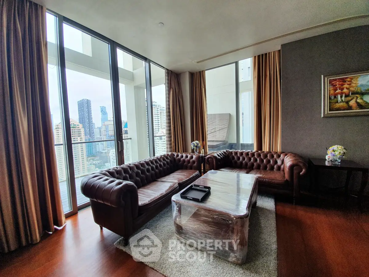 Luxurious living room with stunning city view and elegant leather sofas