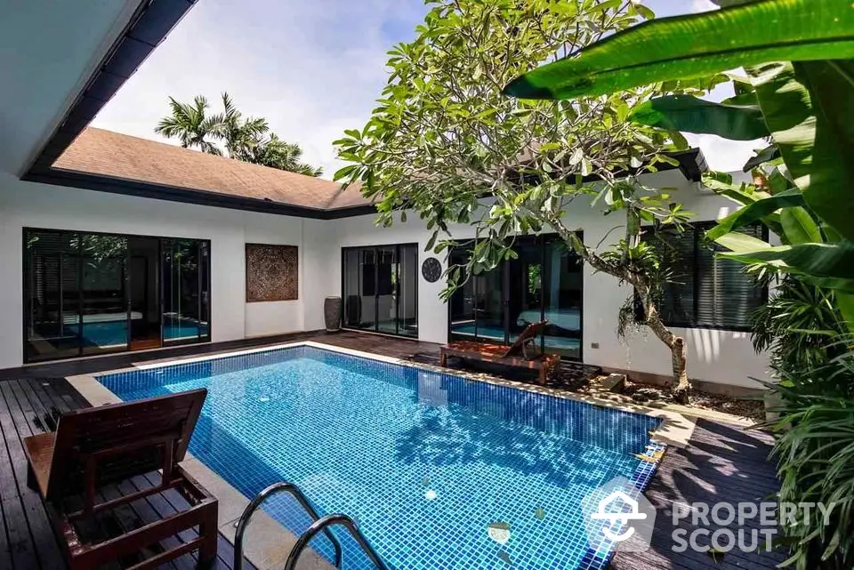 Luxurious villa with private pool and lush garden, perfect for relaxation and entertainment.