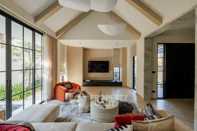 Luxurious modern living room with vaulted ceiling and stylish decor