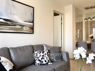 Modern living room with stylish decor and comfortable seating, perfect for relaxation and entertaining.