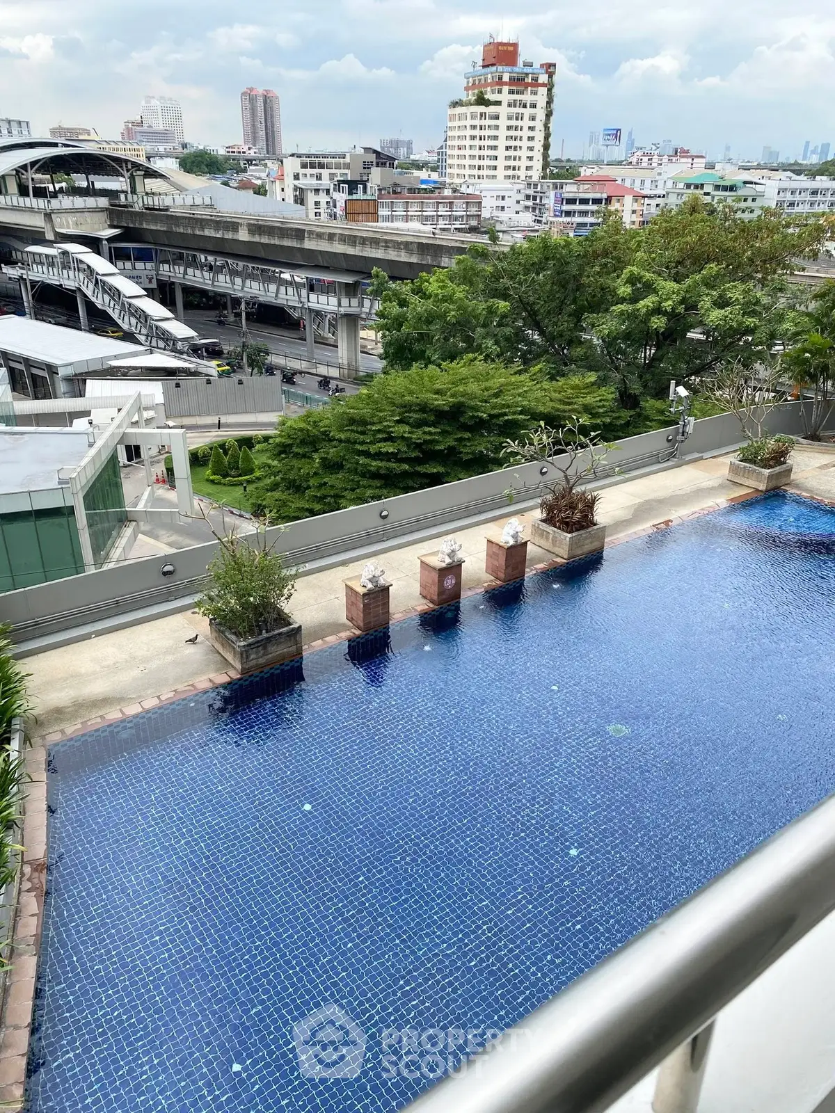 Stunning rooftop pool with cityscape view, perfect for urban living.