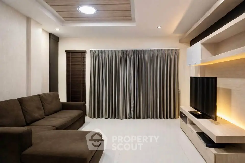 Modern living room with sleek furniture and ambient lighting