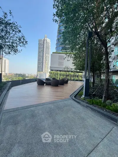 Stunning rooftop terrace with modern seating and city skyline views, perfect for relaxation and entertainment.