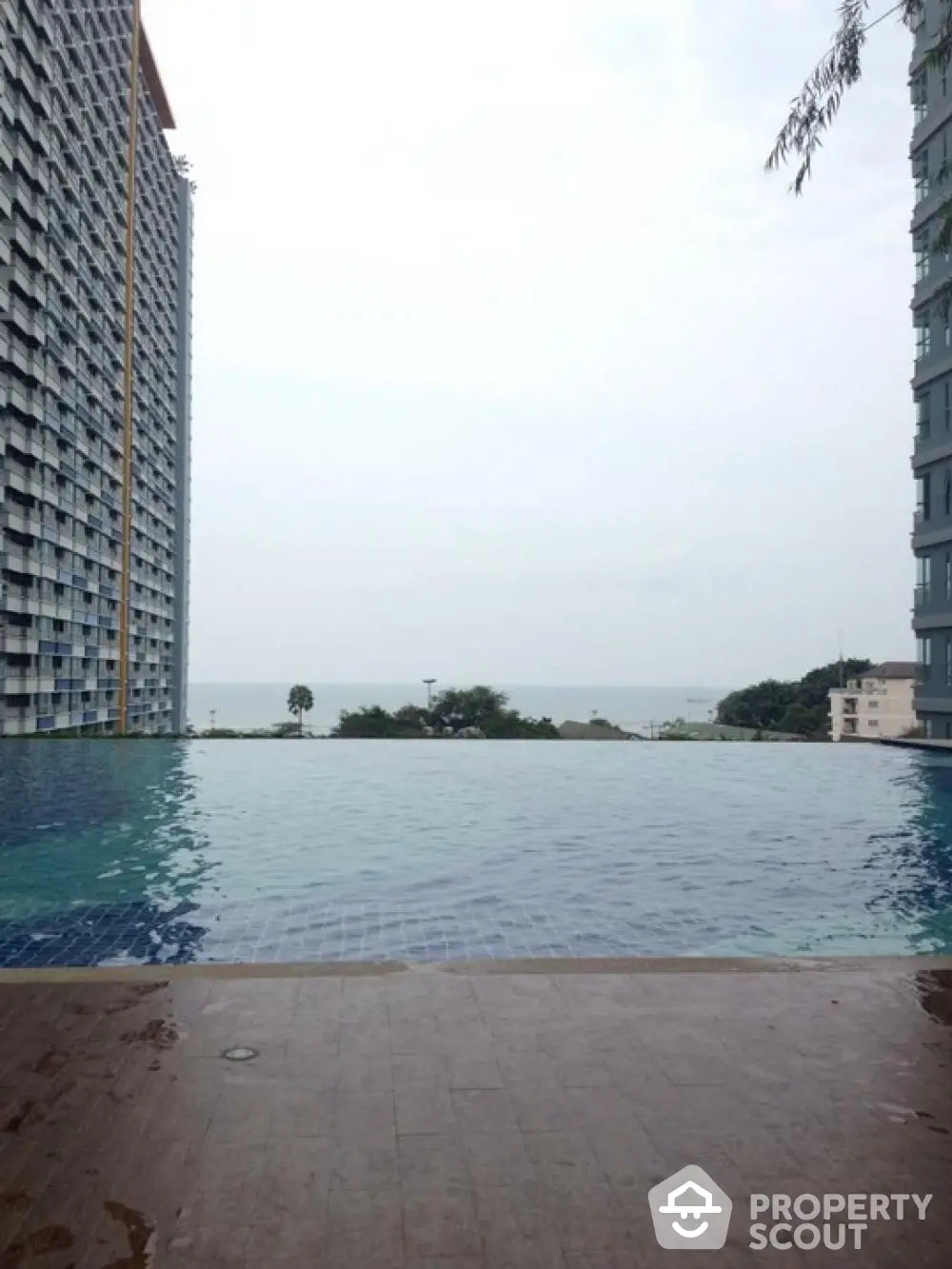 Stunning infinity pool with ocean view in modern high-rise building