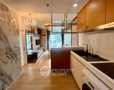 Luxurious modern kitchen with open layout and elegant marble accents