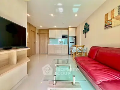 Modern living room with red sofa and open kitchen layout