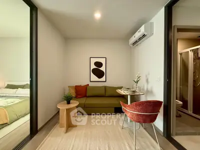 Modern studio apartment with cozy living area and stylish decor