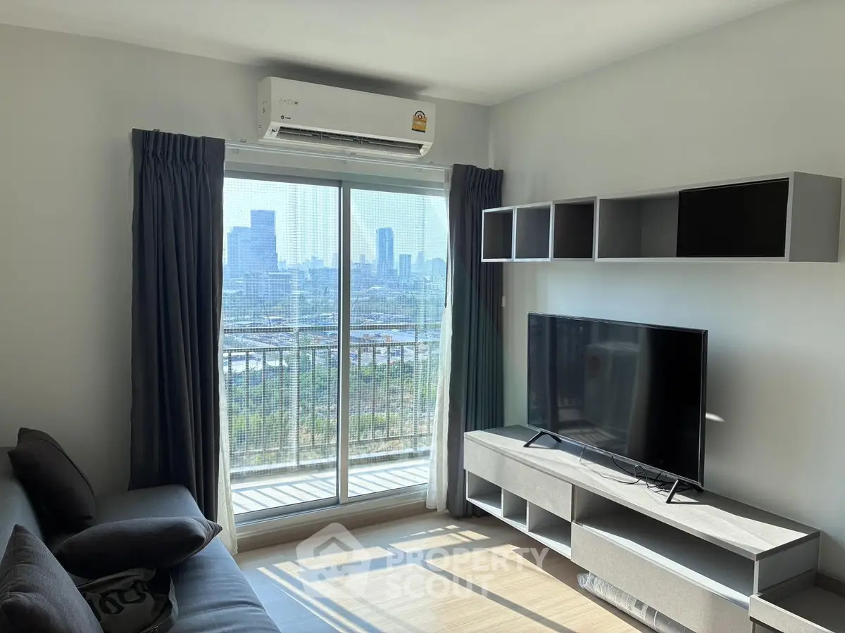 Modern living room with city view, featuring sleek furniture and large TV, perfect for urban living.