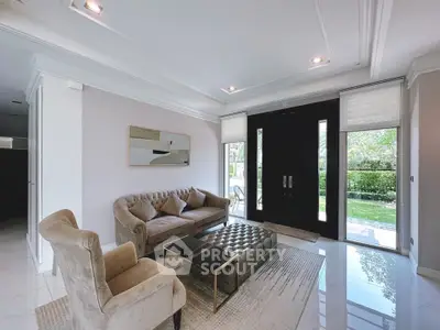 Elegant living room with plush seating and garden view