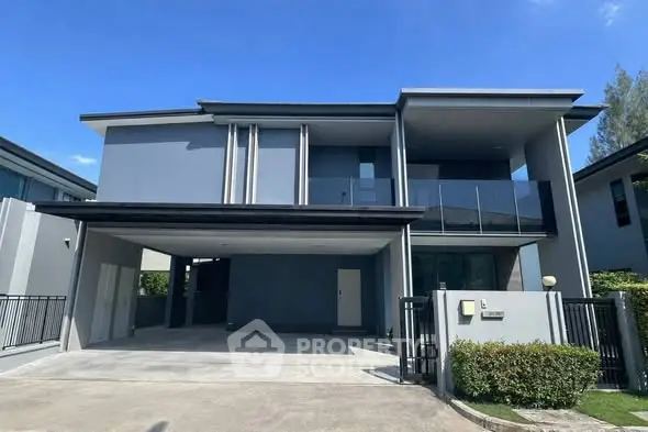 Modern two-story house with sleek design and spacious driveway