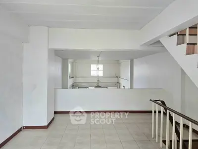 Spacious interior with modern staircase and open layout, perfect for customization.