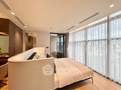 Luxurious modern bedroom with floor-to-ceiling windows and elegant decor