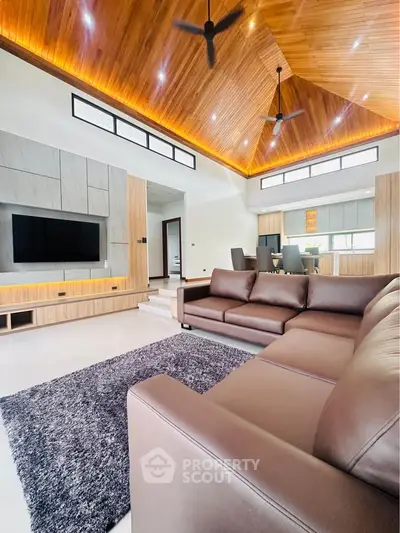 Luxurious modern living room with high wooden ceiling and elegant furniture
