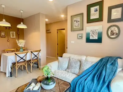 Charming living room with cozy decor and dining area, perfect for relaxation and entertaining.