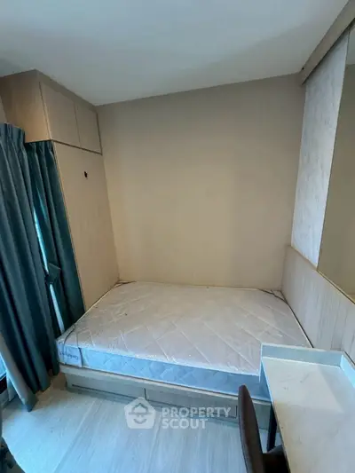 Cozy bedroom with built-in storage and natural light