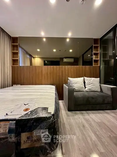 Modern bedroom with stylish decor and cozy seating area