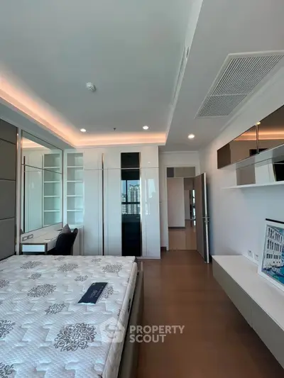 Modern bedroom with sleek design and ample storage space