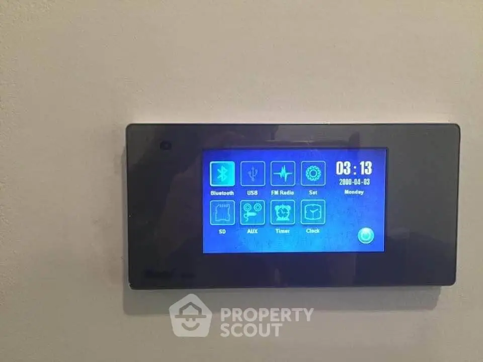 Modern smart home control panel with digital display on wall