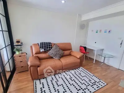 Cozy living room with leather sofa and modern decor in bright apartment