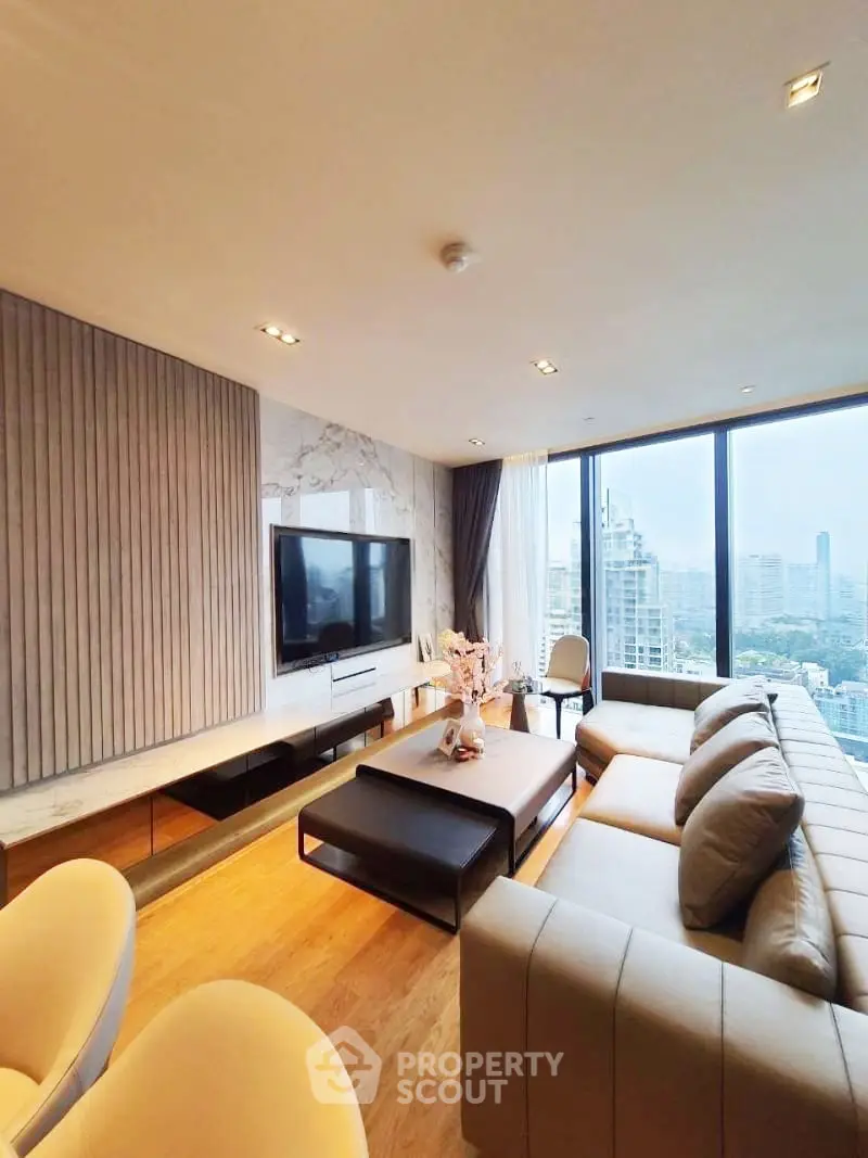 Luxurious modern living room with panoramic city views and elegant furnishings.