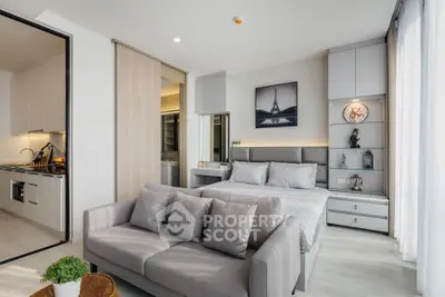 Modern studio apartment with cozy living area and stylish kitchen